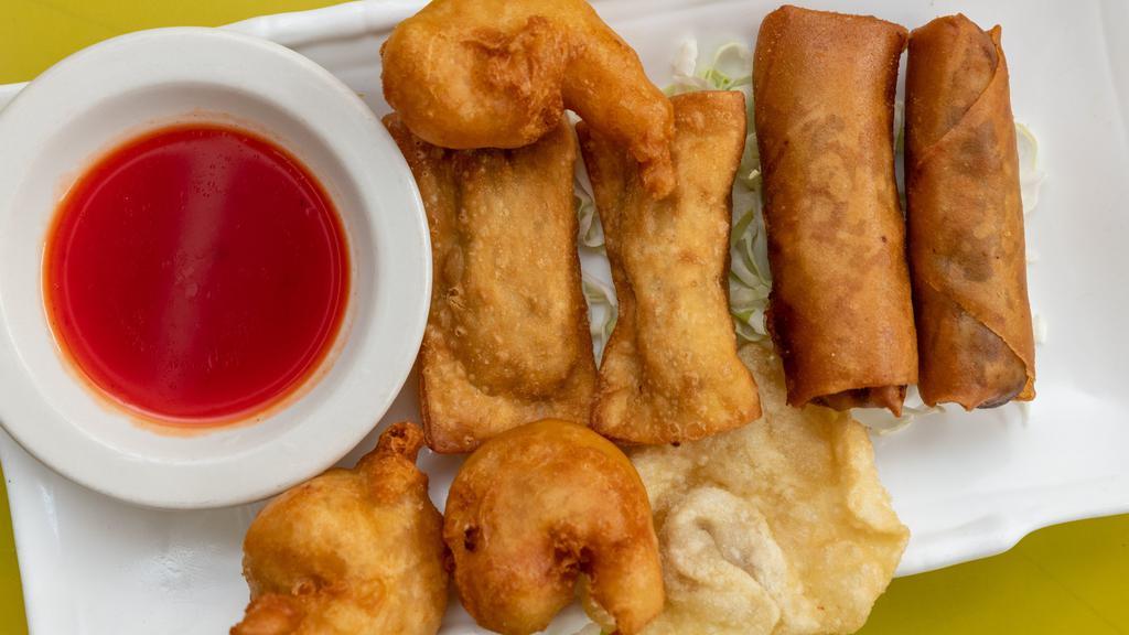 Pupu Platte · 3 Crispy Gau Gee, 3 Crispy Wonton, 2 Spring Rolls, and 3 Fried Shrimp. Comes with sweet and sour sauce.