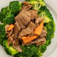 Beef Broccoli ￼ · Beef and broccoli stir fry with carrots.