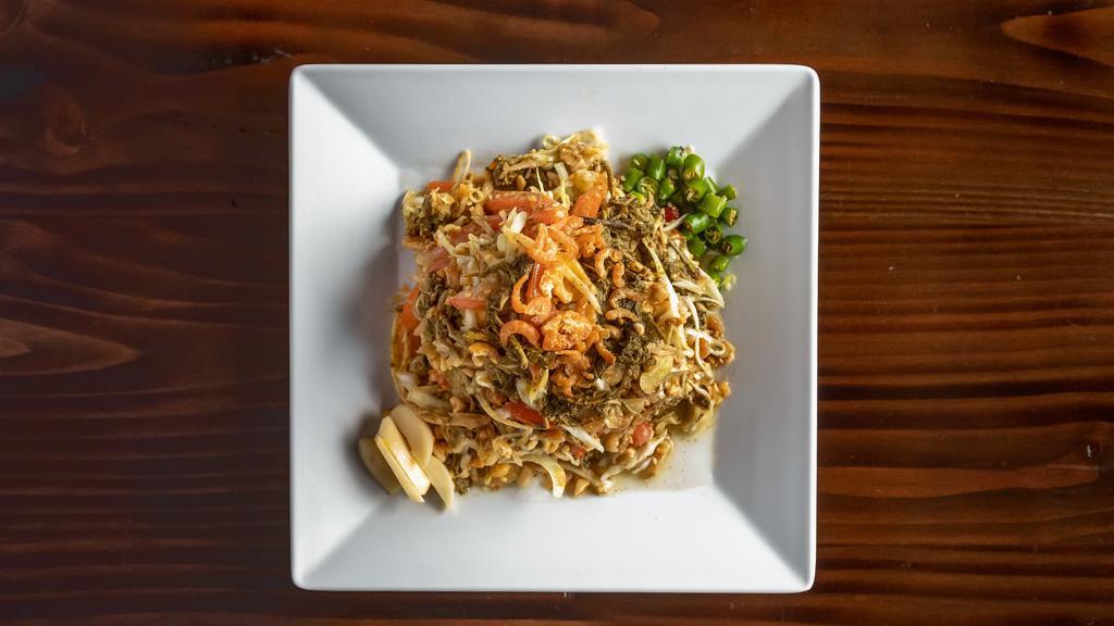 Latphat Thoke · Fermented tea leaves, tomato, cabbage fried shrimp, crushed peanut, fried garlic, sesame seed and hundred minuscule distinct shift in crunch.