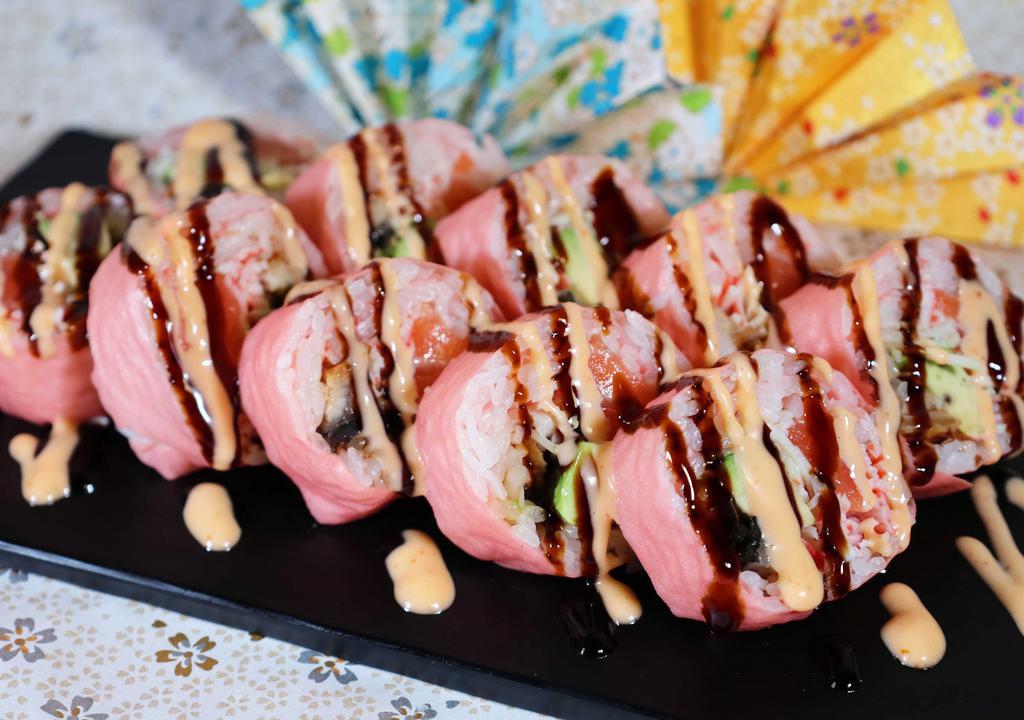Pink Lady Roll (10 Pc) · With salmon, kani, avocado and eel, wrapped with pink soybean paper eel sauce and spicy mayo sauce on top.