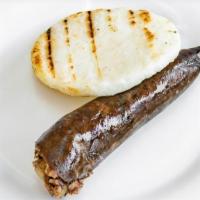 Morcilla Con Arepa O Papa · Made from scratch in our kitchen. Fresh Colombian blood sausage.