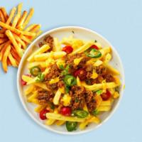 Lock And Loaded Fries · Idaho potatos sliced, fried until golden brown, and garnished with salt, cheddar cheese, bac...
