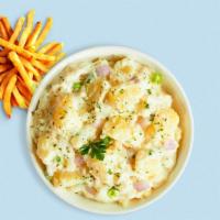 All Mashed Up · Mashed Idaho potatoes cooked, seasoned with garlic, butter, and topped with crispy bits of b...