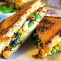 Vegan Grilled Cheese Sandwich  · Made with Non GMO Vegan cheddar cheese& Non GMO French Fries.