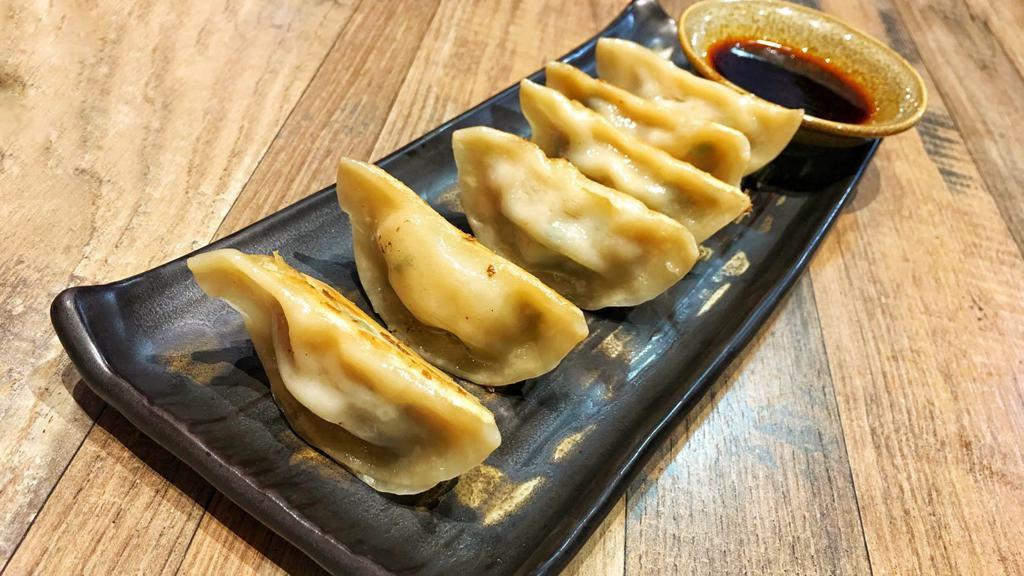 Seasonal Gyoza · Six pieces of Housemade Pork Gyoza with Cabbage, & Scallion. Served with Spicy Peanut Butter Sauce.