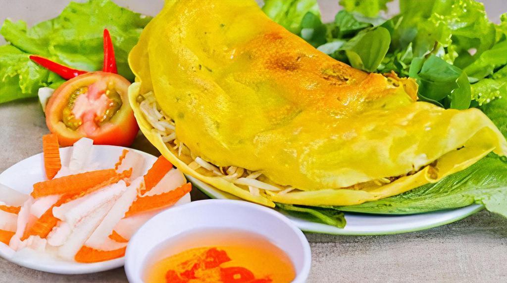 Bánh Xèo · Vietnamese pancake with shrimp and pork.
