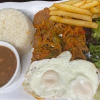 Ecuadorian Churrasco · Beef cooked with onions, tomato, peppers, and two eggs.