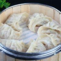 Steamed Dumplings · 8 pieces. Choice of protein.