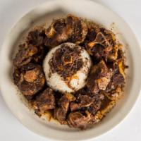 Stewed Oxtails · With choice of rice and additional side.