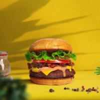 Classic Thrill Vegan Burger · Seasoned plant-based burger patty topped with lettuce, roasted tomatoes, and caramelized oni...