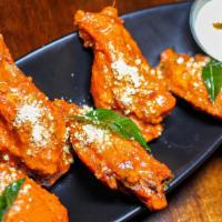 555 Wings · Gluten free. Chicken wings, chili tomato sauce, broken cashew, curry leaf ranch.