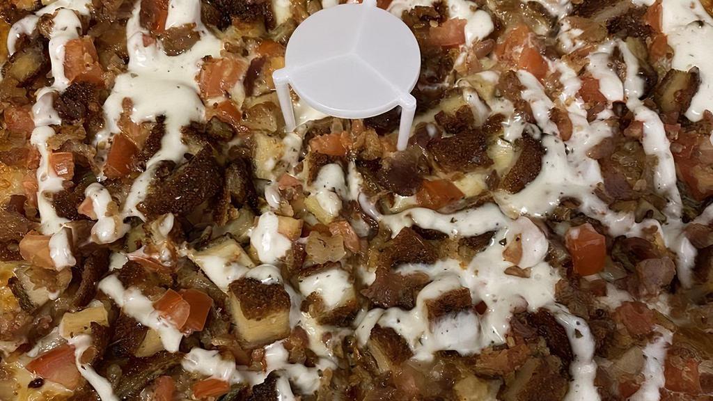 Chicken Bacon Pizza · With dreaded chicken, tomato & bacon, topped with ranch sauce - no tomato sauce.