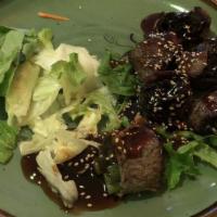Beef Negimaki · Beef rolled with scallion in teriyaki sauce.