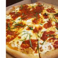 Margherita · Homemade tomato sauce and mozzarella cheese topped with a sprinkle of basil.