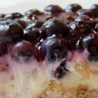 Blueberry Jamboree Bar To Go · Pecan shortbread crust layered with a cream cheese and whipped cream filling. With a fresh b...