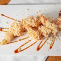 Edison Roll · Spicy tuna, shrimp tempura inside, top with spicy crabmeat.