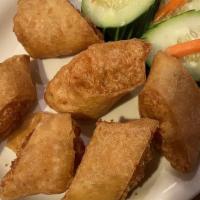 Hai Gun (6 Pieces) · Deep-fried ground shrimp and pork wonton pieces wrapped in rice paper. Served with chili sau...