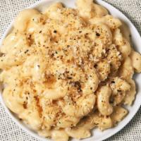 Mac And Cheese De Mentequilla · Large portion of macaroni prepared with freshly made cheese sauce, brown butter, and bread c...