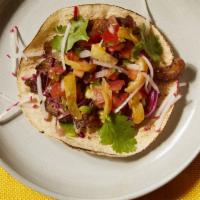 Al Pastor Taco · The signature Mexican street taco. Thinly sliced, marinated Heritage pork served with cilant...