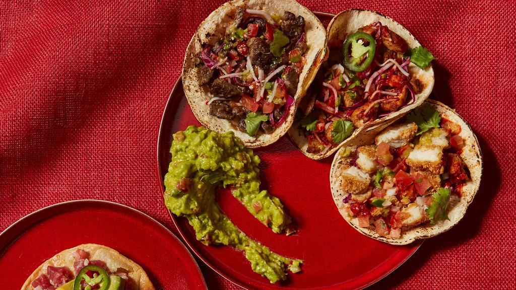 Taco Bar For 9 · 4 tacos per person with your choice of proteins. Served with onion, cilantro, pico de gallo and salsa, and warm tortillas.
