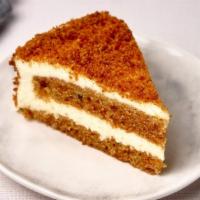 Layered Carrot Cake Slice · Layered carrot cake slice with fresh vanilla bean cream cheese, currants, and pineapple.