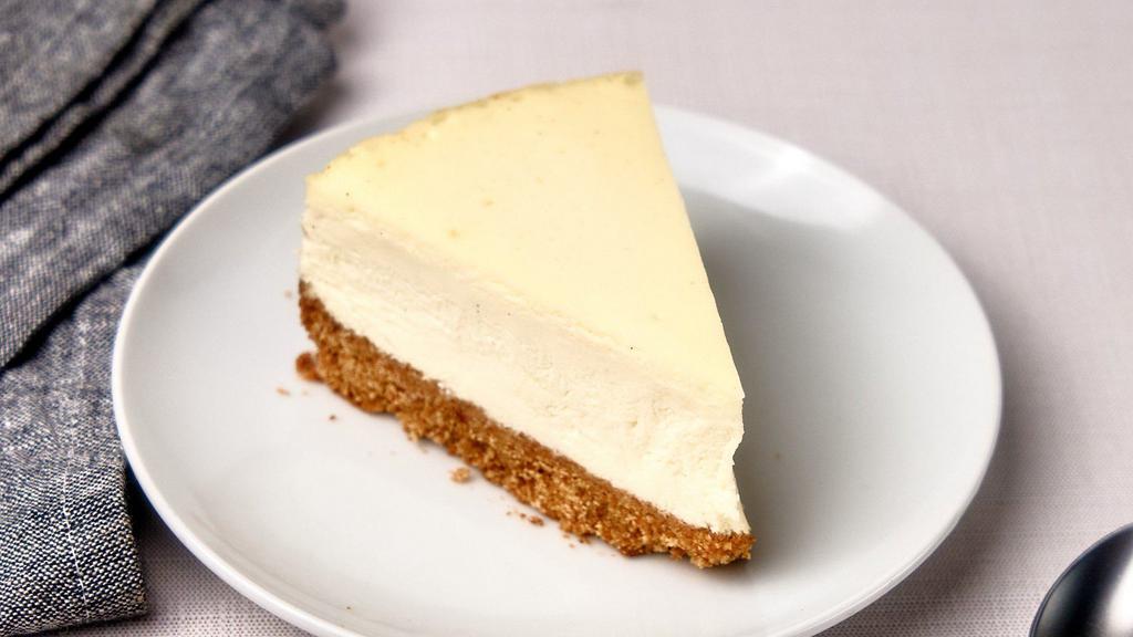New York Cheesecake Slice (Gluten Free) · New York style cheesecake slice made from fresh whole vanilla and gluten free graham cracker crust.