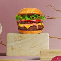 Hamburger · Juicy beef patty with lettuce, tomato, mayo, and ketchup on a fresh bun.