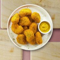 Chicken Nuggets  · Bite sized nuggets of chicken breaded and fried until golden brown. Served with your choice ...
