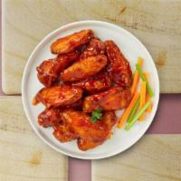 Buffalo Wings  · Chicken tenders breaded and fried until golden brown before being tossed in buffalo sauce.