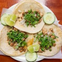 Tacos · Favorite. Three pieces. Made with your choice of meat, cilantro, cebolla, rabanos and limon.