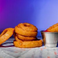 Onion Rings · Tempura battered onion rings served with your choice of one sauce.