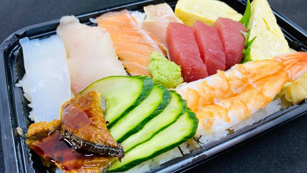 Chirashi Sushi A · Tuna, Salmon, Yellow tail, Albacore, Boiled Shrimp, Calamari, Japanese omelet, Eel,  on the sushi rice
(Sorry no Substitutions)