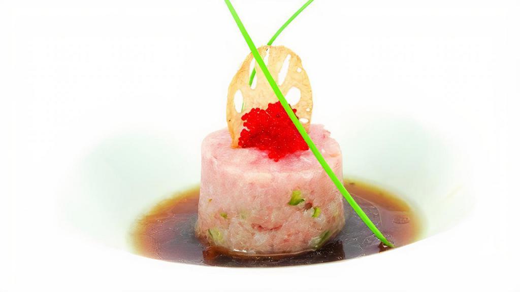 Yellowtail Tartare 黄尾鱼塔塔 · Yellowtail served with quail egg and chef special sauce. （秘制酱汁和蛋黄搭配黄尾鱼肉）