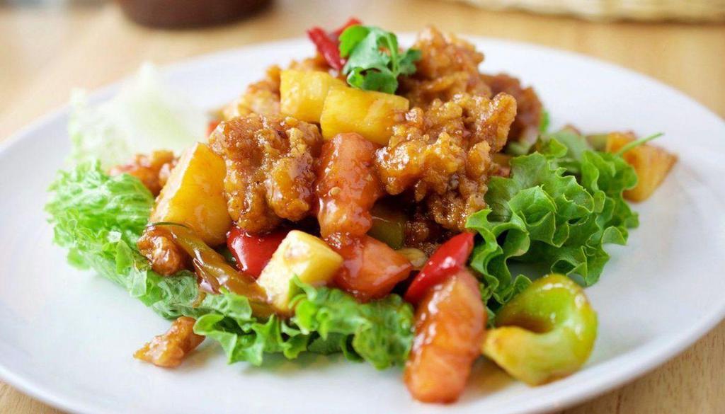 Pineapple Sweet And Sour Chicken 菠萝甜酸鸡 · Wok-sauteed with bell pepper, onion, cucumber and pineapple in sweet and sour sauce.