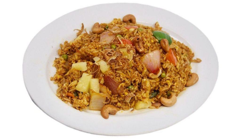 Thai Pineapple Fried Rice 泰式菠萝炒饭 · Spicy. Pineapple chunks, cashew nuts, egg, topped with crispy shallots.