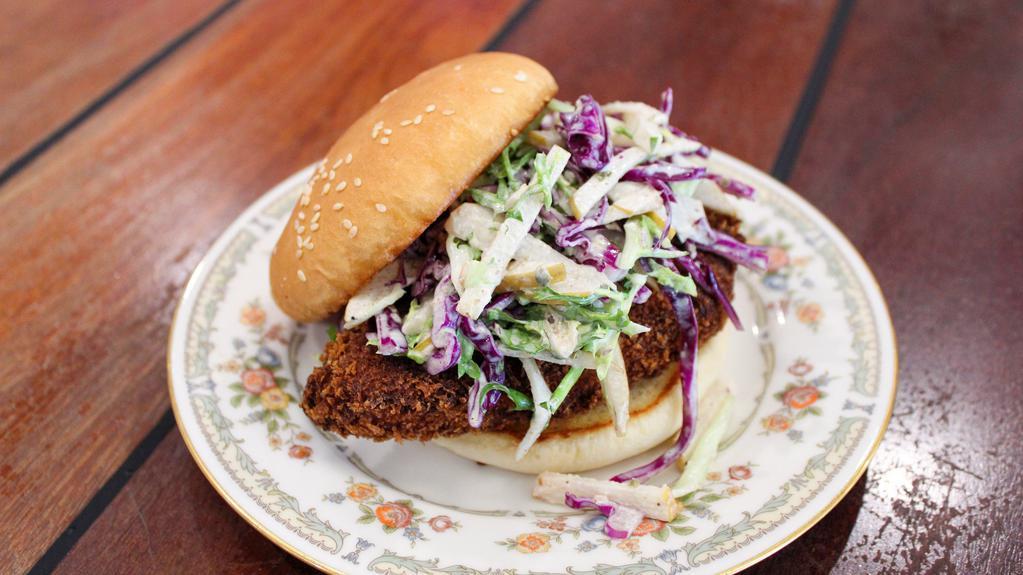 Fish Sando · panko breaded mahimahi, fried and topped with cabbage slaw tossed with asian pear, caper and dill tarter