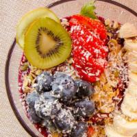 Queen Bee Acai Bowl · Acai, mixed berries, pineapple, topped with fresh fruit, coconut, granola, honey.