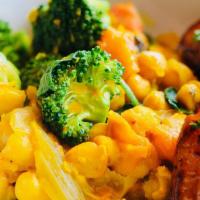 Curried Coconut Chickpea Stew · Curried chick peas cooked in coconut milk with spices and veggies. Served over a choice of q...