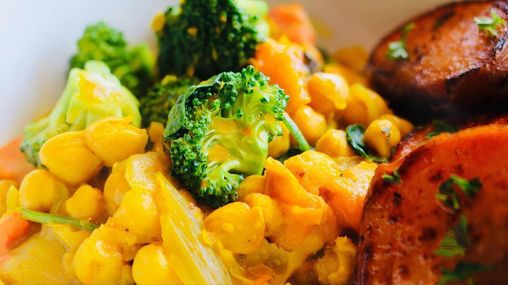 Curried Coconut Chickpea Stew · Curried chick peas cooked in coconut milk with spices and veggies. Served over a choice of quinoa, brown rice or sweet potato.