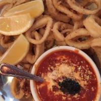 Fried Calamari · Floured calamari rings flash fried, served with marinara sauce for dipping