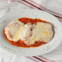 Chicken Parmigiana · Breaded chicken cutlet topped with tomato sauce and melted mozzarella cheese