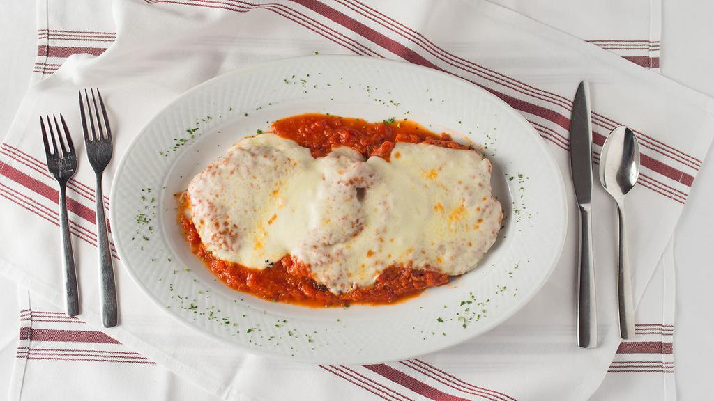 Chicken Parmigiana · Breaded chicken cutlet topped with tomato sauce and melted mozzarella cheese