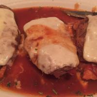 Chicken Sorrentino · Chicken breast layered with prosciutto, eggplant and mozzarella cheese in a marsala wine sauce