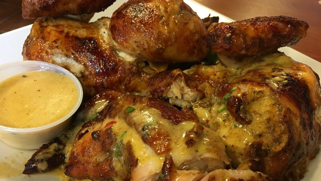 Whole Chicken Alone · No sides. Comes with 3 garlic mojo sauces and 2 spicy green sauces.