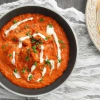 Butter Chicken Mild Spicy With Rice · Chicken gets cooked in tomatoes and butter gravy until the meat is fall off the bone soft se...