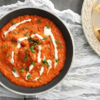 Butter Chicken Medium Spicy With Rice
 · Chicken gets cooked with tomatoes and butter gravy until the meat is fall off the bone soft,...