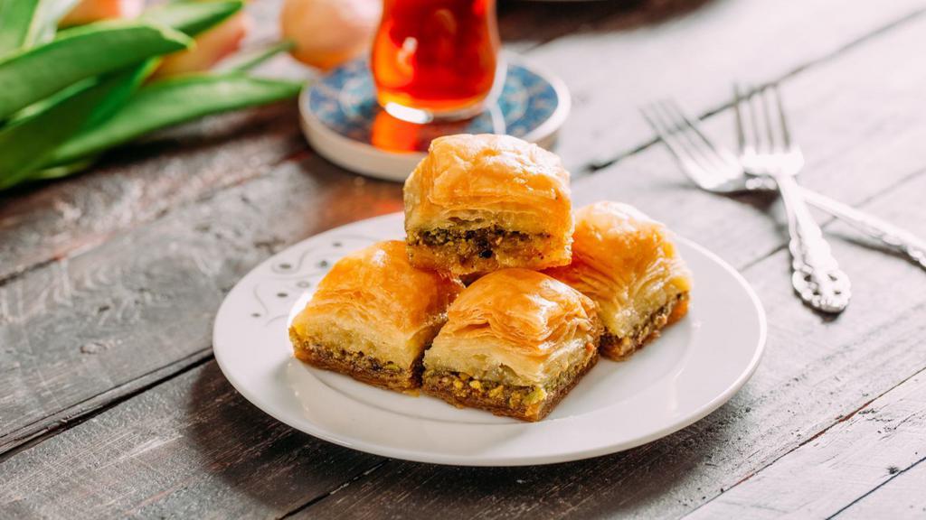 Baklava
 · Rice, sweet pastry made of layers of phyllo dough filled with chopped nuts and sweetened with syrup or honey.