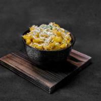 Brown Butter Mac & Cheese · Macaroni prepared with a housemade cheese sauce, beurre noisette, and bread crumbs.