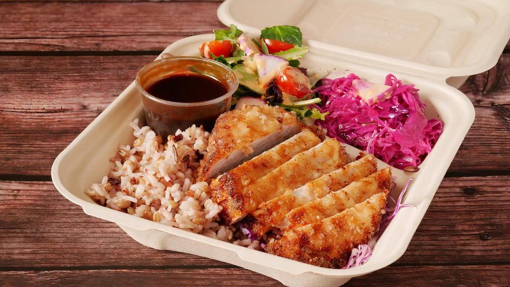 Tonkatsu Katsu Plate · Our shio koji brined tonkatsu (sliced) over a bed of red cabbage, served with multigrain rice and 2 rotating salads/sides of the day.