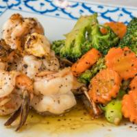 Jumbo Shrimp Garlic · Grilled marinated jumbo shrimp sautÃ©ed and flavored with garlic sauce, served with steam br...